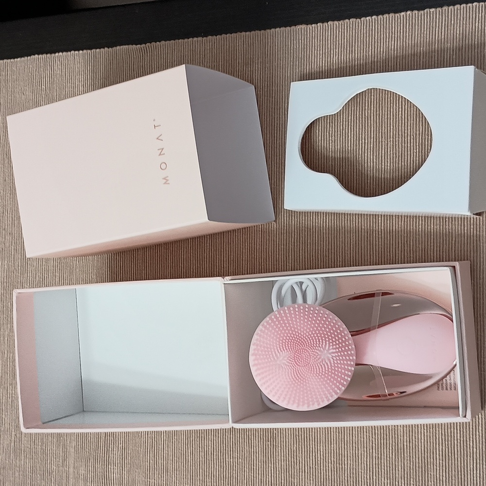 Brand new Monat face exfoliating brush with charging USB
